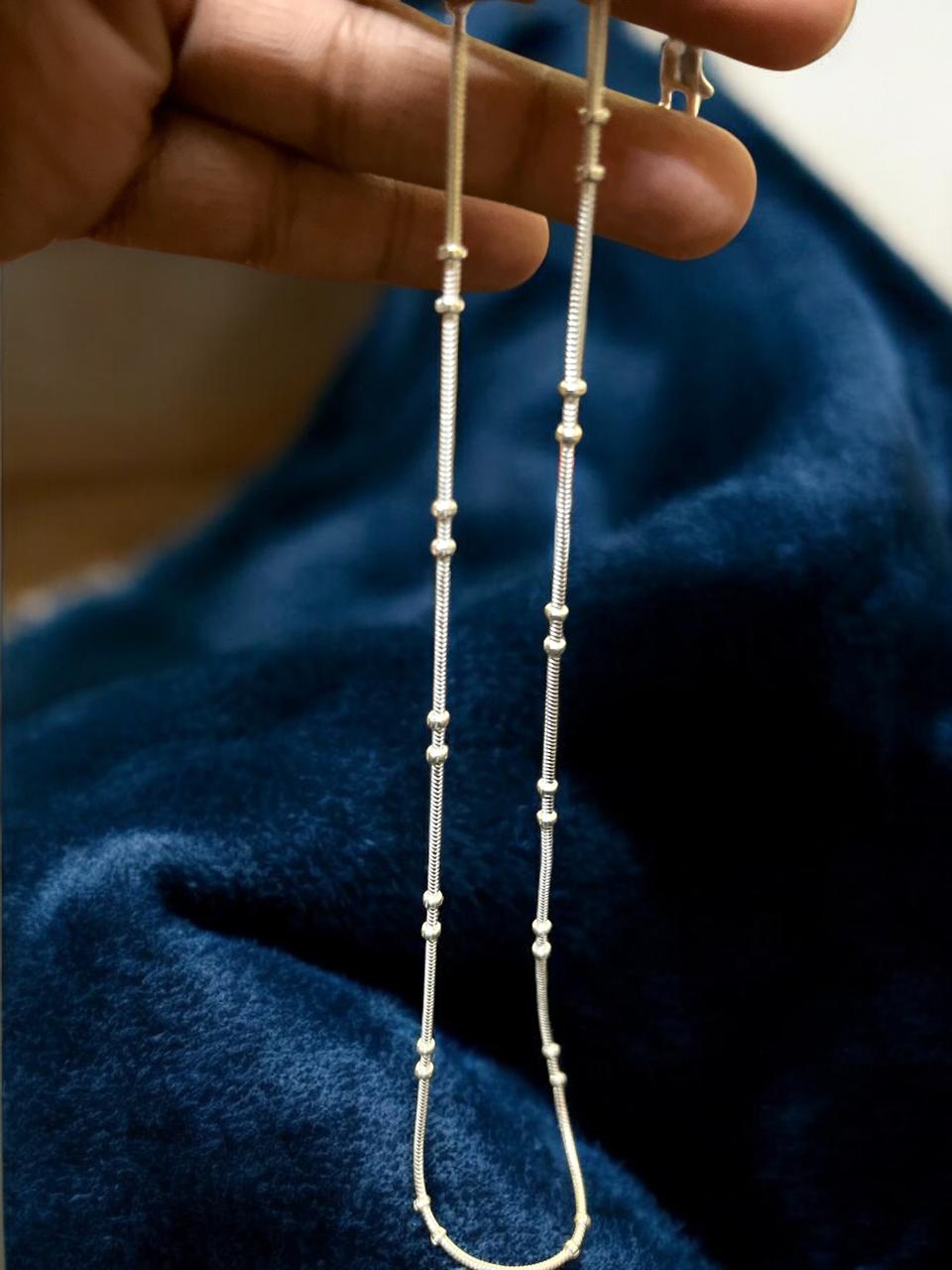 Silver Chain with beads in middle