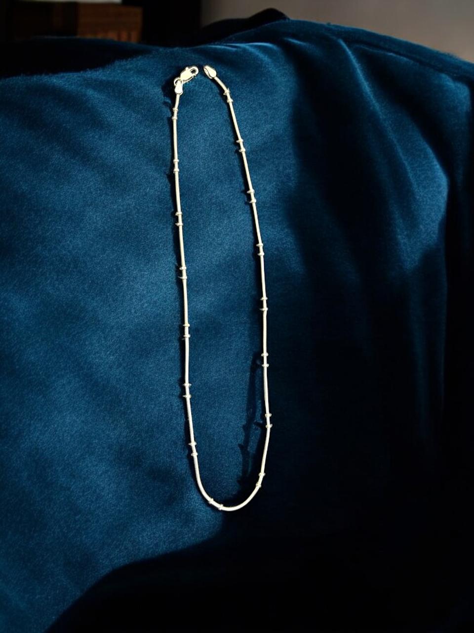 Silver Chain with beads in middle